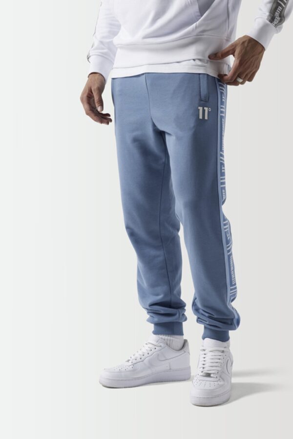 11 DEGREES Pantalon " RETRO TAPED SLIM FIT JOGGERS " color azul