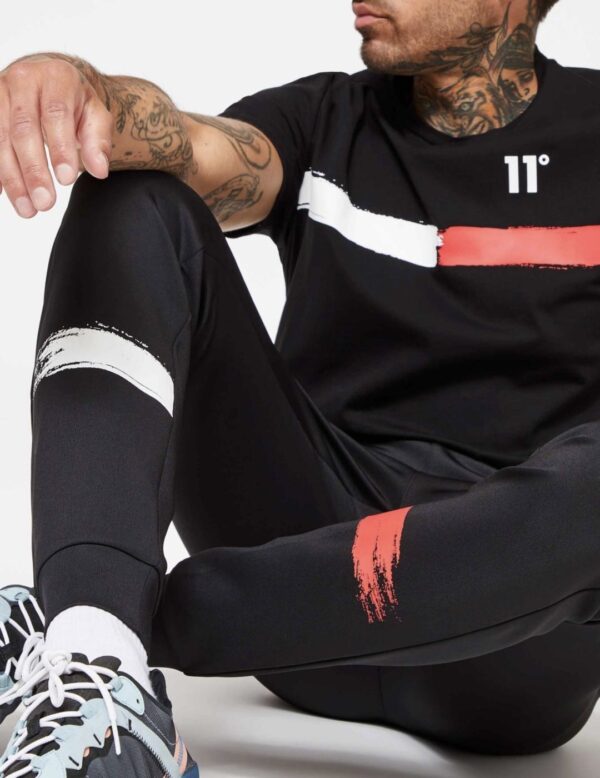 11 DEGREES Pantalon " Paint StrokeTrackpants " color negro