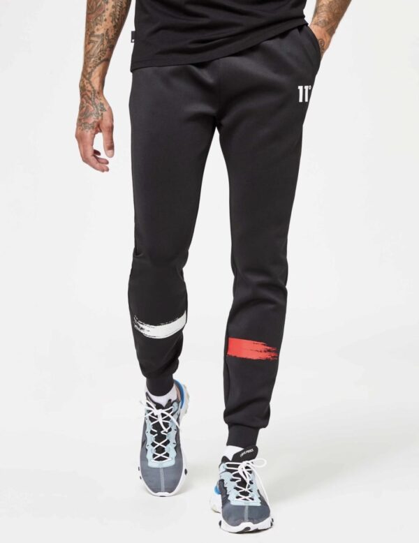 11 DEGREES Pantalon " Paint StrokeTrackpants " color negro