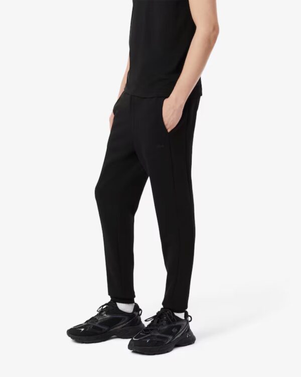 LACOSTEPantalon basico negro